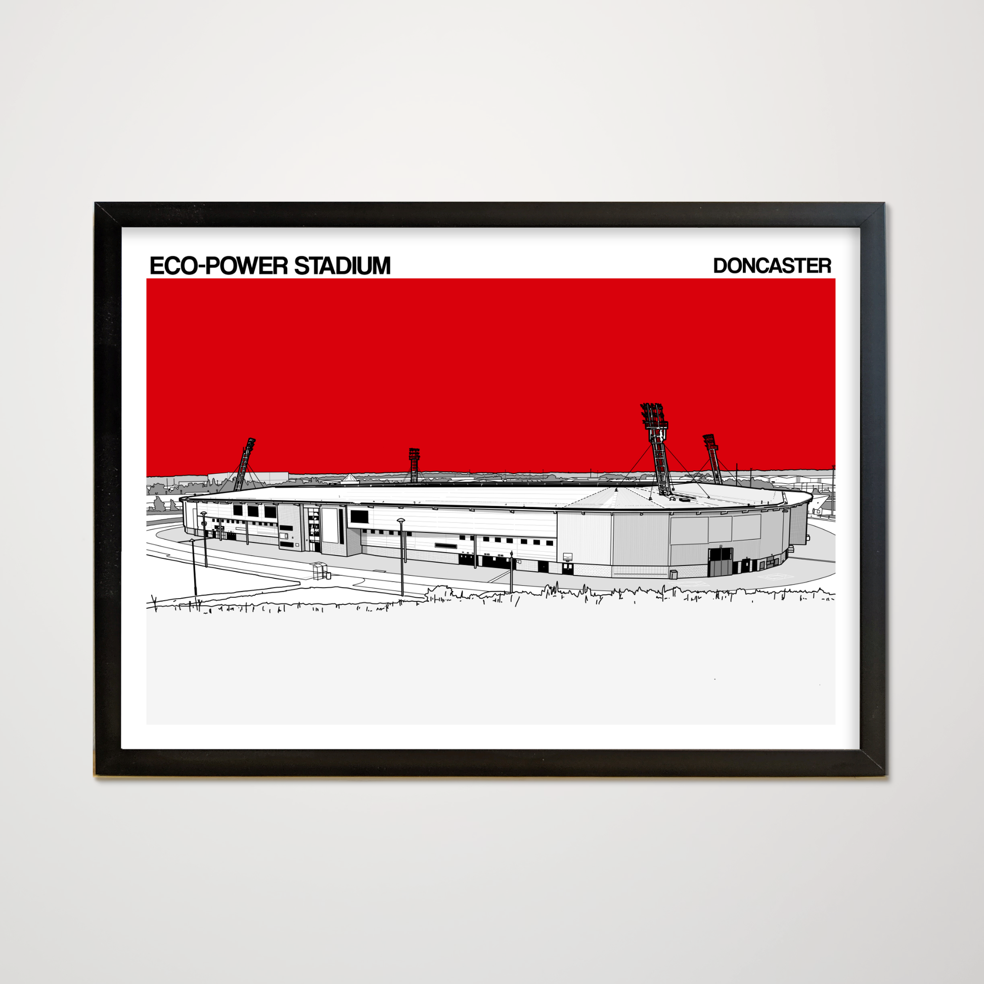 Framed artwork of Eco-Power Stadium with a red background