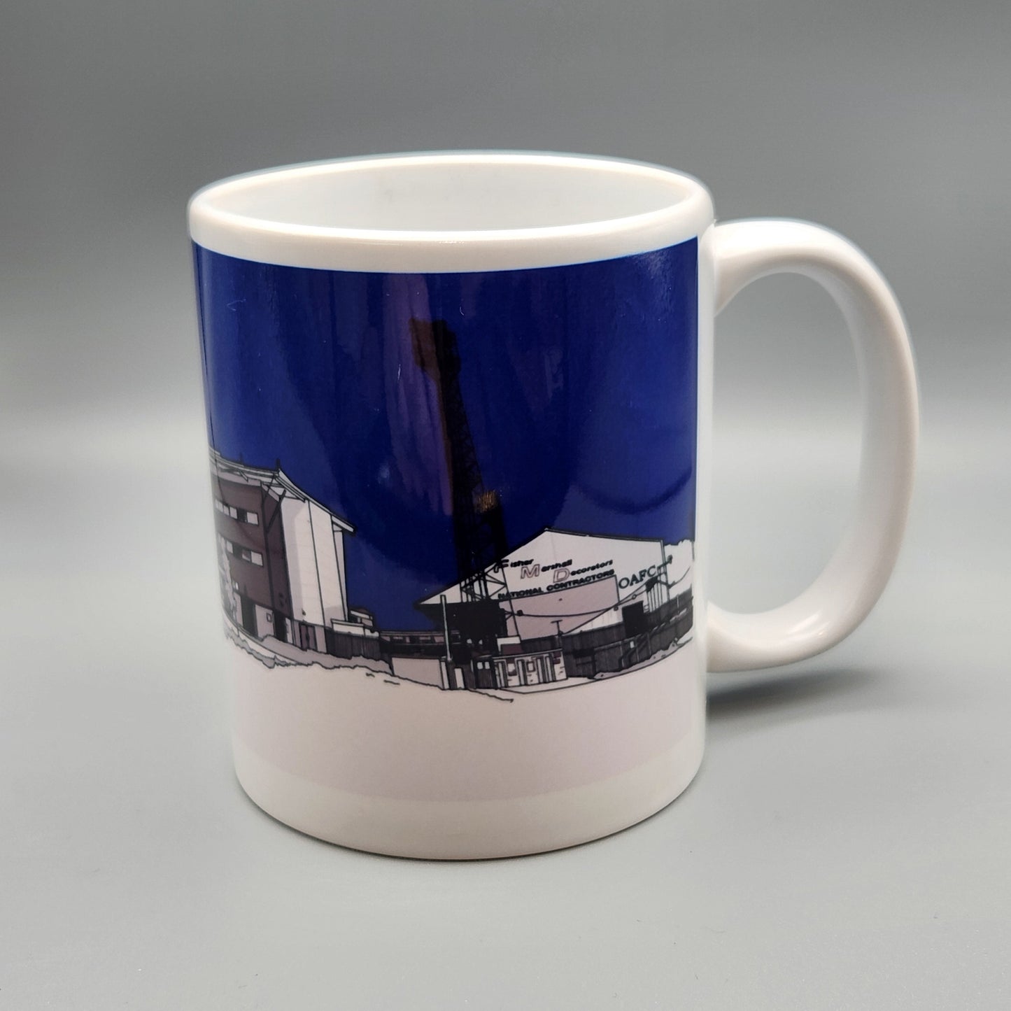 Mug with a blue and white design on a gray background