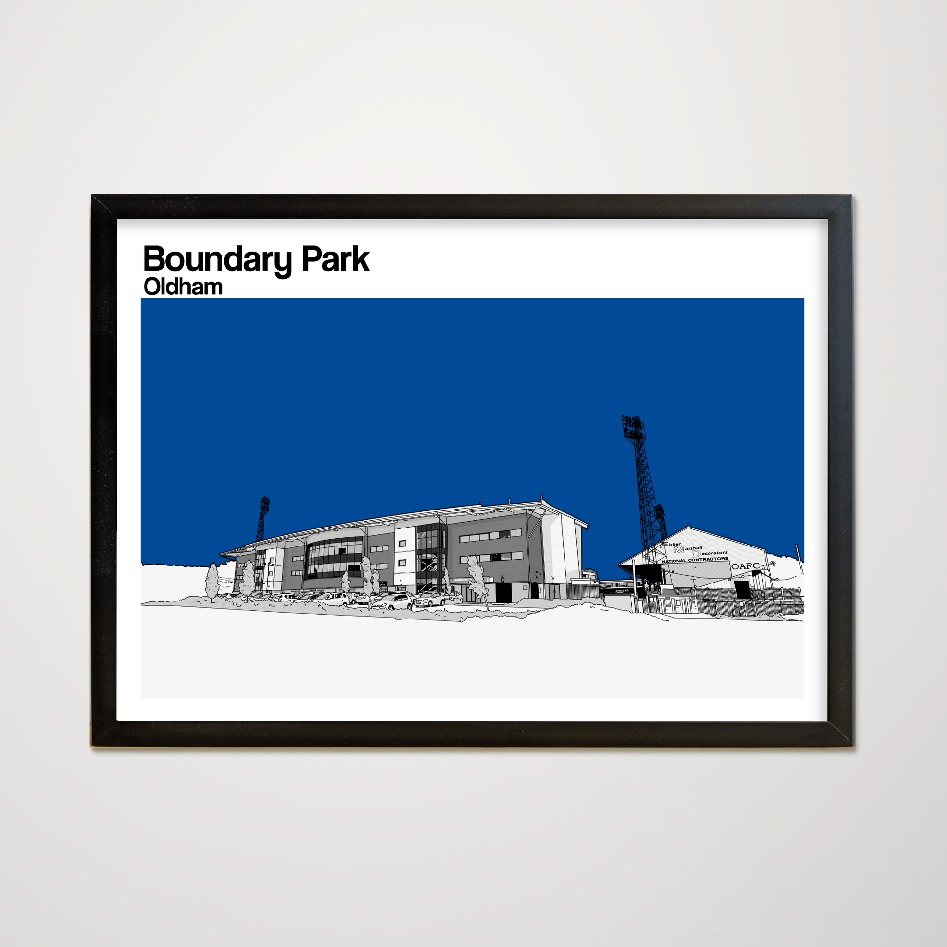 Framed artwork of Boundary Park stadium in Oldham with a blue sky background.